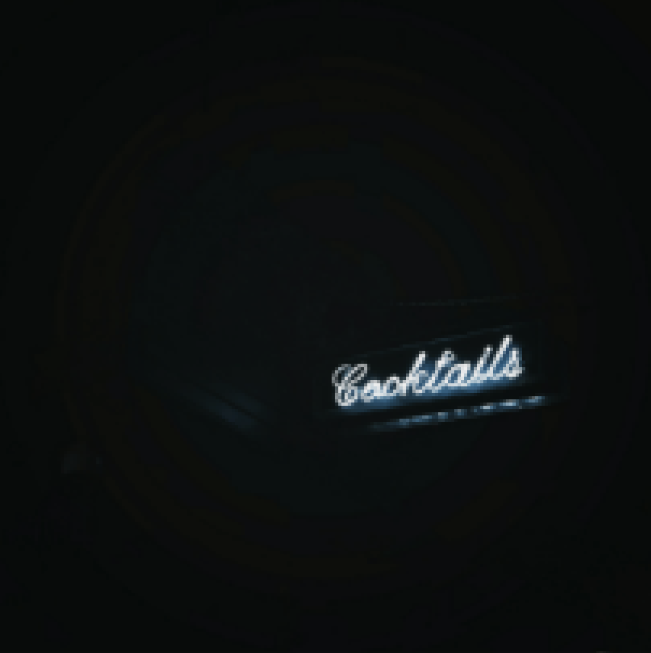 Neon sign saying Cocktails